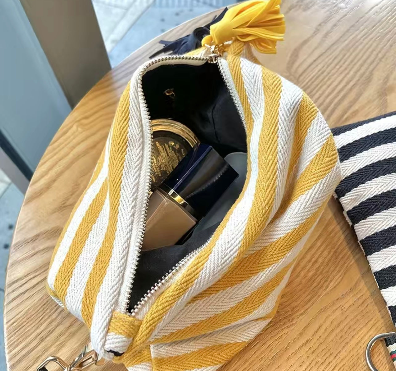 Striped tassle clutch